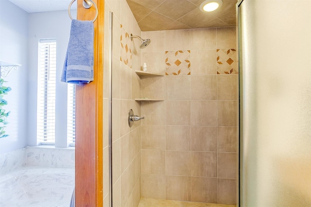 bathroom with a tile shower