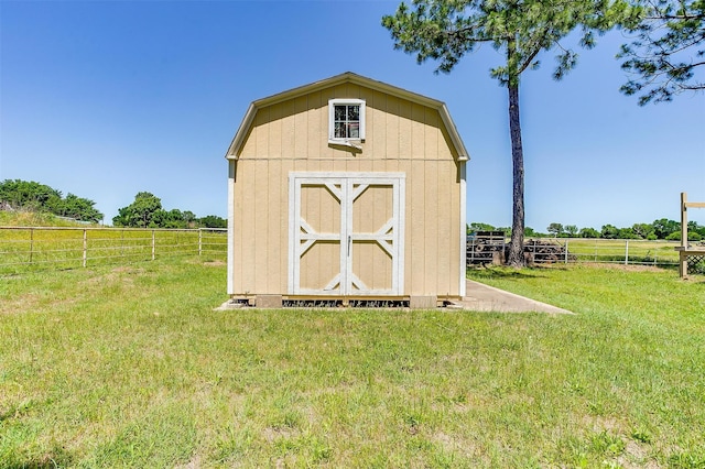 view of shed / structure with a lawn