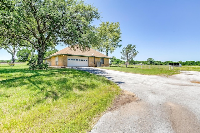 view of front of property with a garage and a front yard