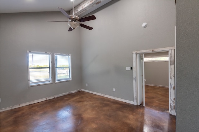 empty room featuring ceiling fan and high vaulted ceiling