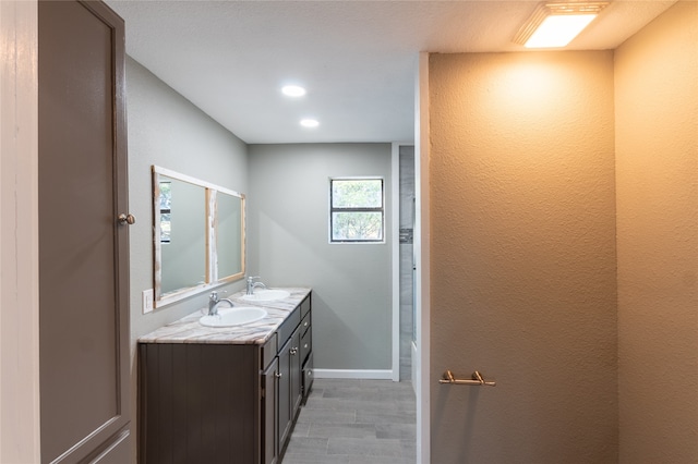 bathroom with vanity and hardwood / wood-style floors