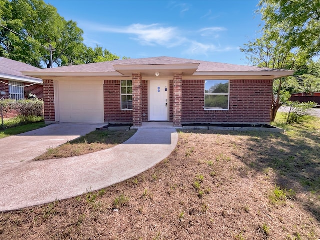 ranch-style home with a front lawn and a garage