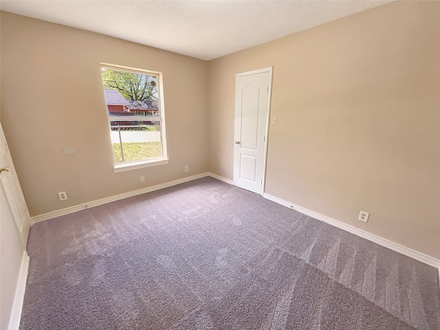 unfurnished room featuring carpet flooring