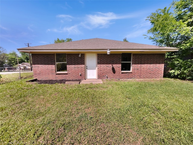 ranch-style house with a front yard