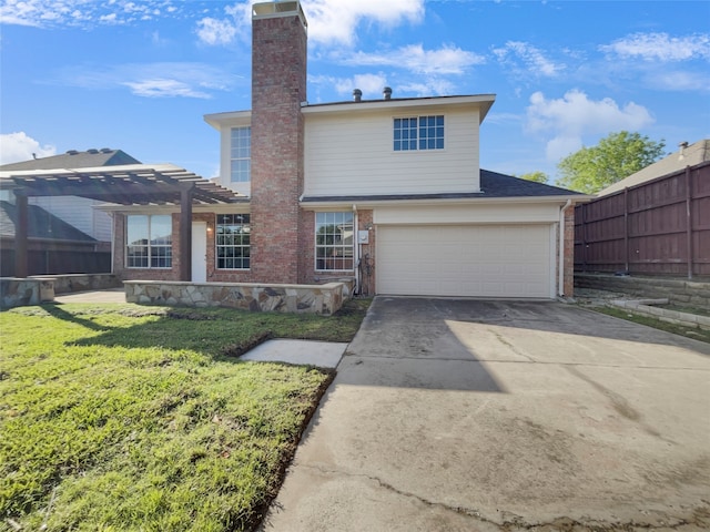 rear view of property with a garage, a pergola, and a lawn