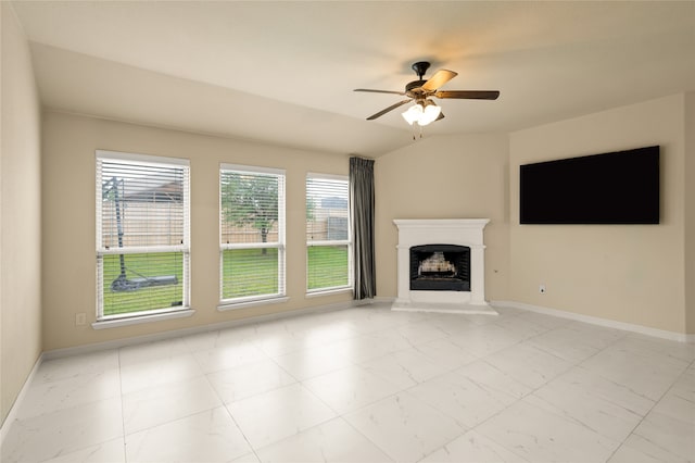 unfurnished living room featuring ceiling fan, light tile floors, and lofted ceiling