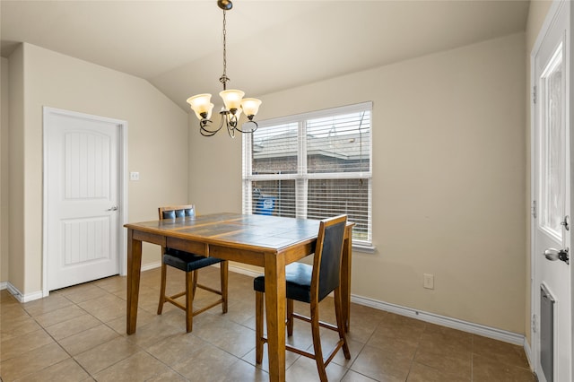 dining space with an inviting chandelier, light tile floors, and lofted ceiling