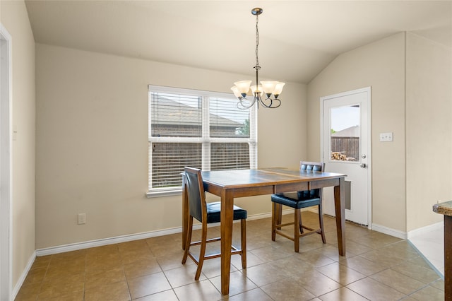 tiled dining room with lofted ceiling and a chandelier