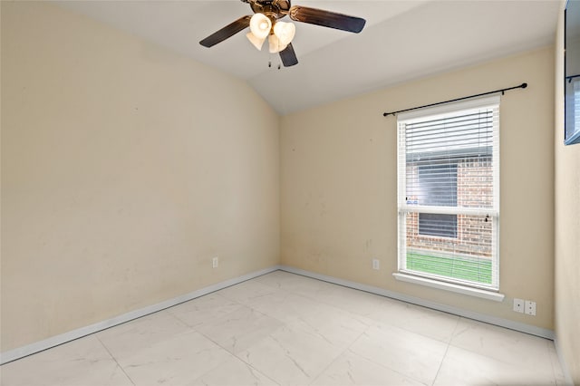 spare room featuring vaulted ceiling, ceiling fan, and light tile flooring