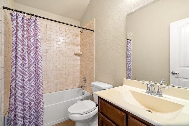 full bathroom featuring shower / bath combo, vanity, and toilet