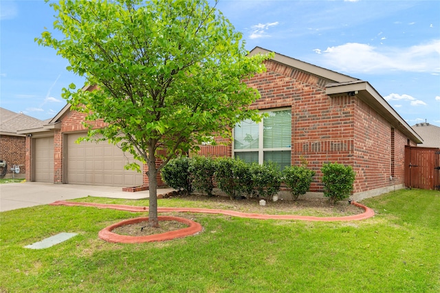 view of front of home featuring a garage and a front lawn