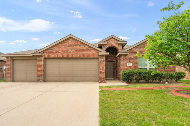 view of front of house with a garage and a front lawn