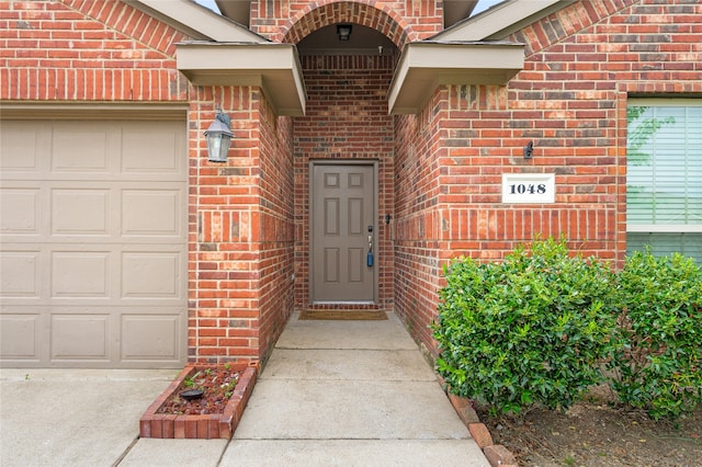 doorway to property featuring a garage