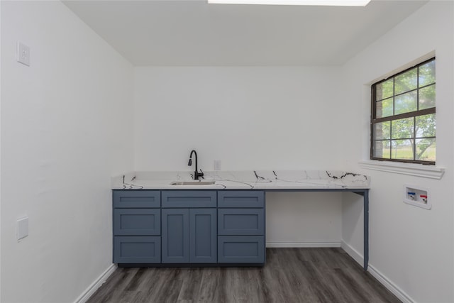 laundry area featuring washer hookup, dark hardwood / wood-style floors, and sink