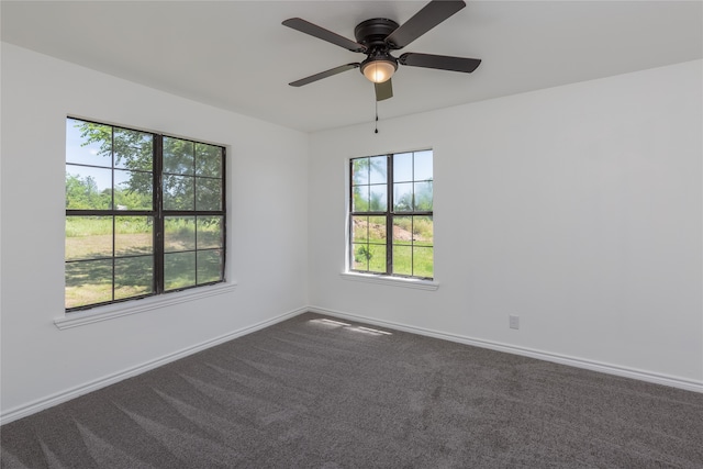 carpeted empty room with a healthy amount of sunlight and ceiling fan