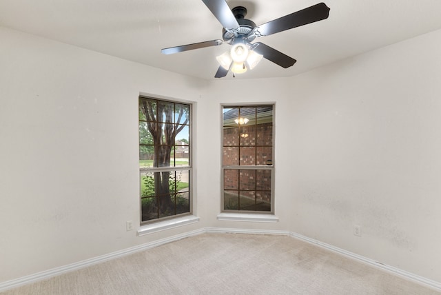 carpeted empty room with ceiling fan