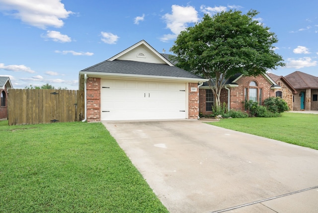 single story home featuring a garage and a front lawn