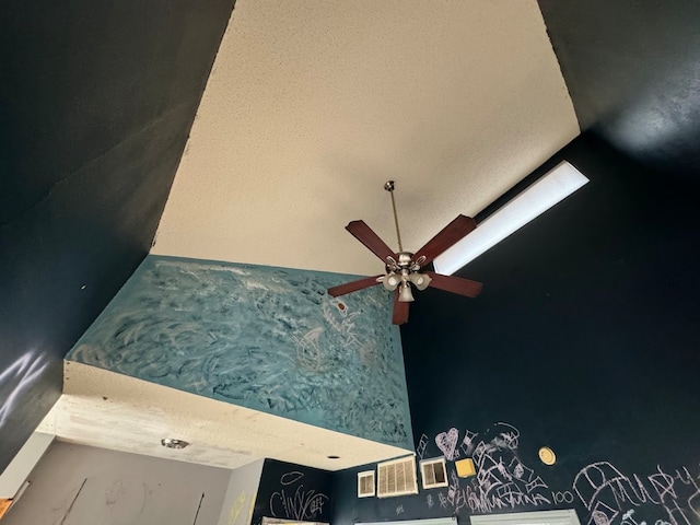 room details featuring a textured ceiling and ceiling fan