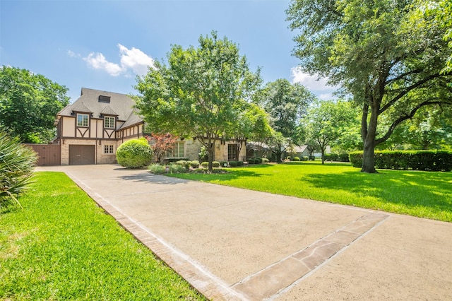 view of front of home with a garage and a front yard