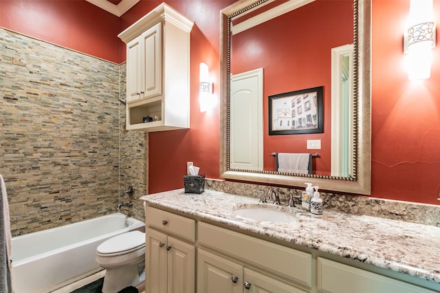 full bathroom with tiled shower / bath, toilet, and vanity