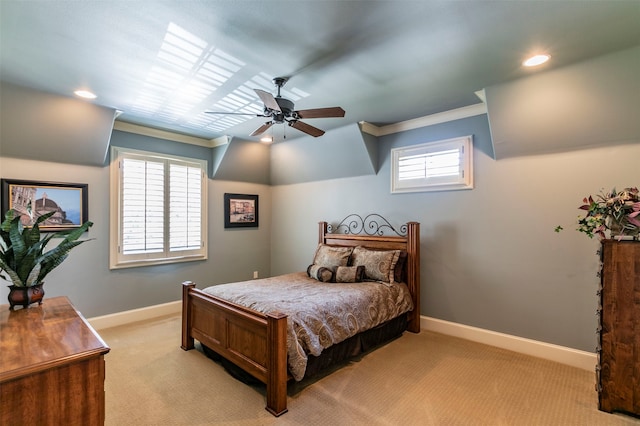 carpeted bedroom with ceiling fan and multiple windows