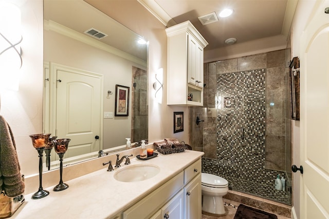 bathroom featuring tile flooring, oversized vanity, toilet, ornamental molding, and a shower with door