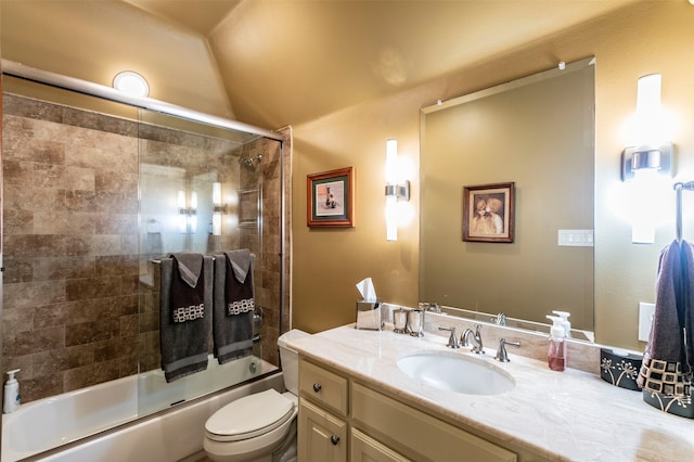 full bathroom with vanity, toilet, and bath / shower combo with glass door