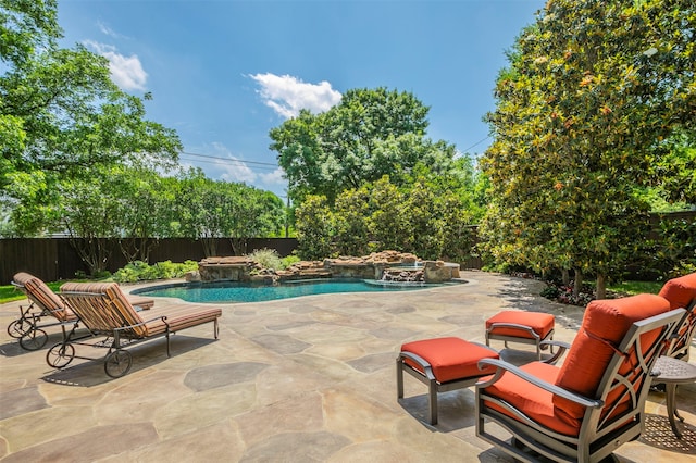 view of swimming pool with a patio and an in ground hot tub