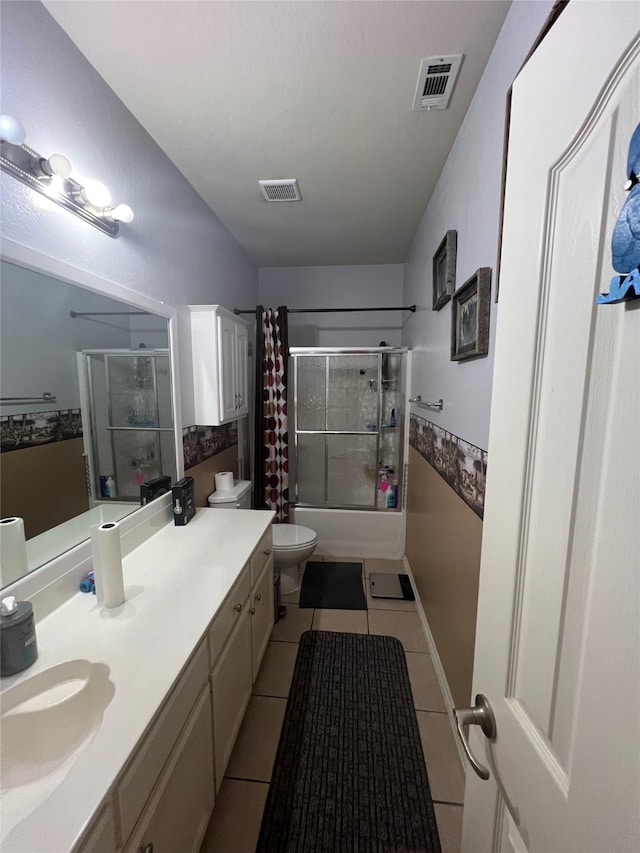 full bathroom featuring vanity, shower / bath combination with curtain, toilet, and tile flooring