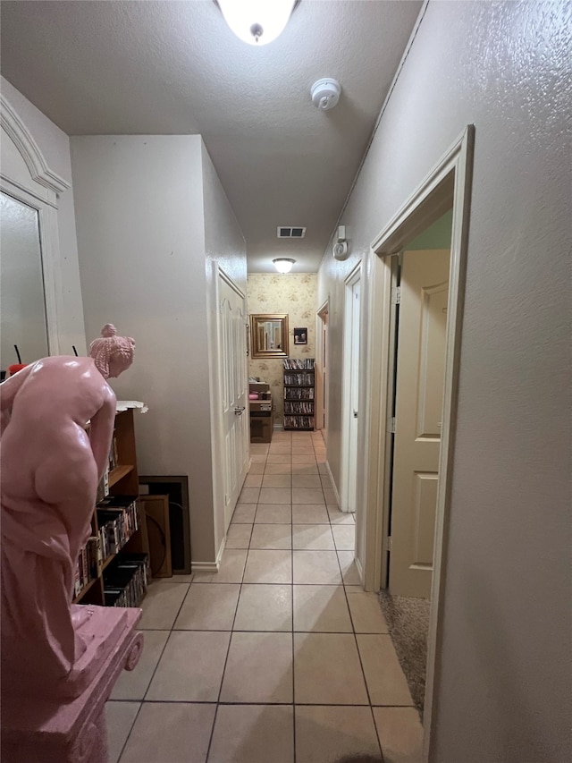 corridor with light tile flooring