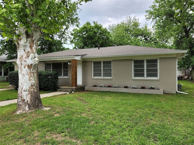 ranch-style home with a front lawn