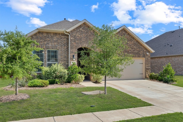 view of front facade with a front yard and a garage