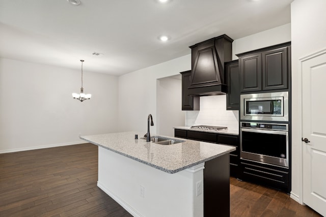 kitchen featuring dark hardwood / wood-style floors, premium range hood, tasteful backsplash, appliances with stainless steel finishes, and sink