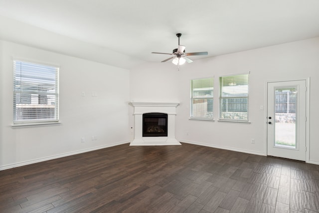 unfurnished living room featuring ceiling fan and hardwood / wood-style floors