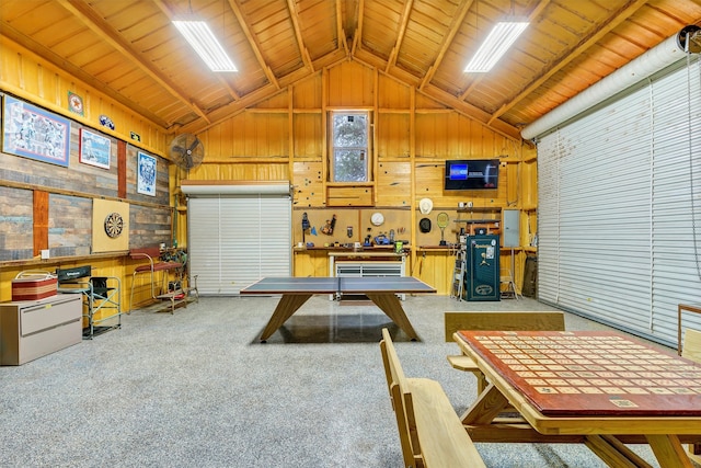 garage with wood walls, a workshop area, and wood ceiling