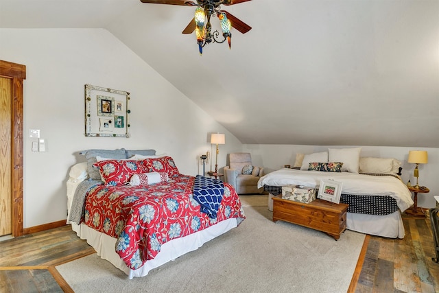 bedroom with hardwood / wood-style flooring, ceiling fan, and lofted ceiling