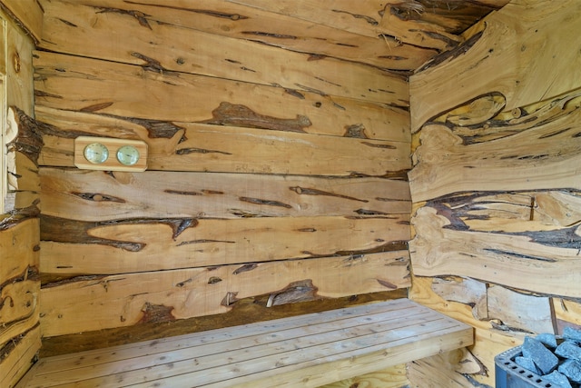 interior space with wood walls and hardwood / wood-style floors