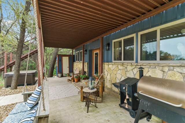 view of patio / terrace featuring a storage unit