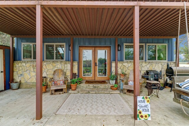 doorway to property with a patio and french doors