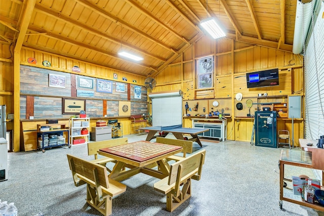 game room featuring wooden ceiling, wood walls, lofted ceiling with beams, and a workshop area