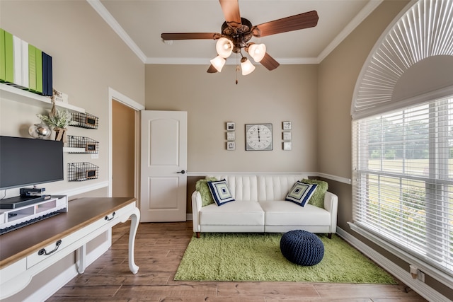 living room with ceiling fan, ornamental molding, and dark hardwood / wood-style flooring