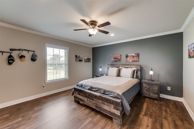 bedroom with ceiling fan, dark hardwood / wood-style flooring, and ornamental molding