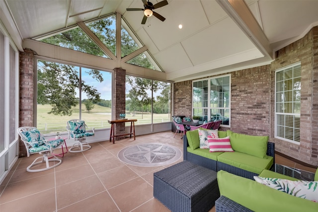 sunroom with a wealth of natural light, ceiling fan, and lofted ceiling