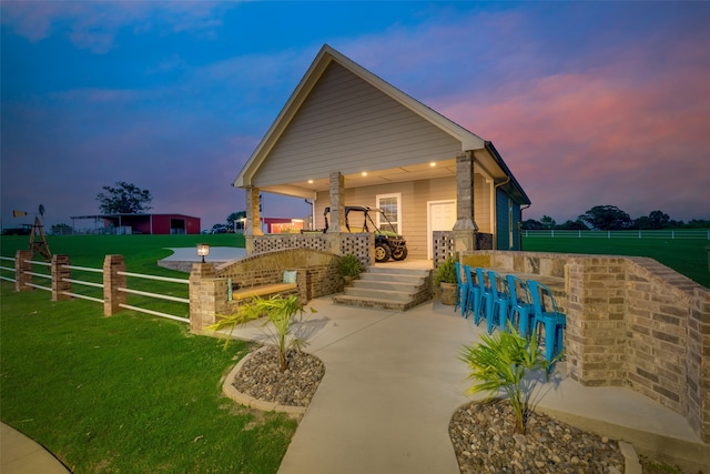 craftsman-style house with a yard