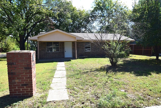 single story home with a front yard