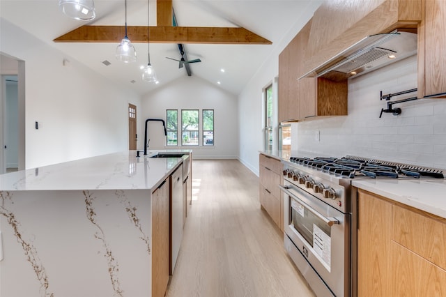 kitchen with light stone countertops, light hardwood / wood-style floors, vaulted ceiling with beams, designer range, and tasteful backsplash