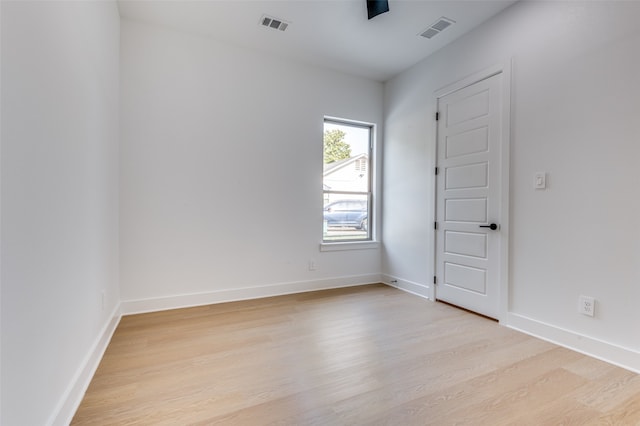 unfurnished room featuring light hardwood / wood-style floors