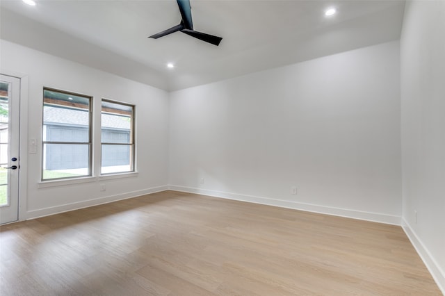 spare room with light hardwood / wood-style flooring