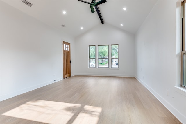 unfurnished room with high vaulted ceiling, beam ceiling, and light hardwood / wood-style flooring