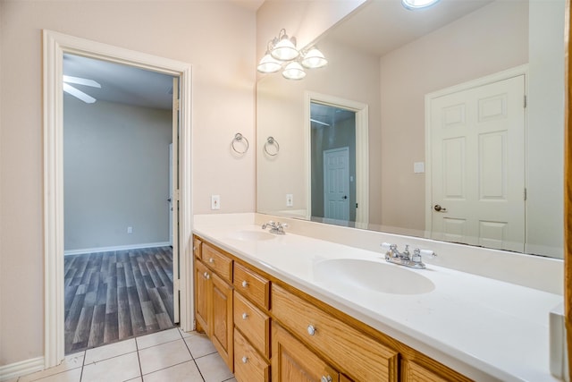 bathroom featuring tile patterned flooring, ceiling fan, and vanity